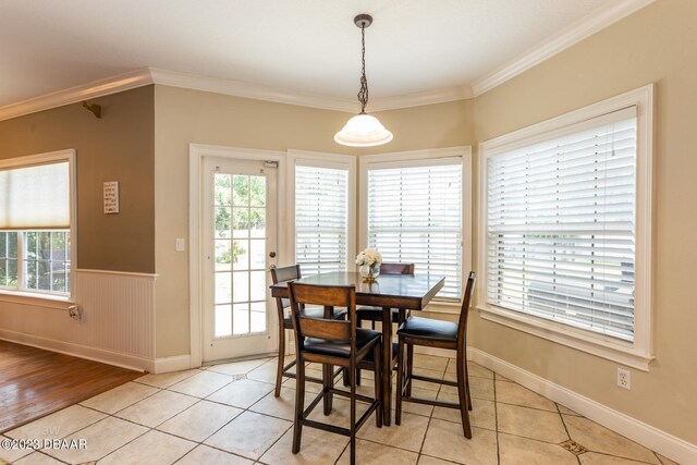 10 Foxhunter Flt, Ormond Beach, FL 32174 - dining room featuring light tile patterned floors, a wealth of natural light, and ornamental molding