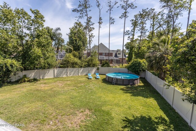 10 Foxhunter Flt, Ormond Beach, FL 32174 - view of yard with a fenced backyard and a fenced in pool