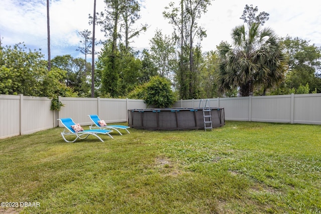10 Foxhunter Flt, Ormond Beach, FL 32174 - view of yard with a fenced in pool and a fenced backyard
