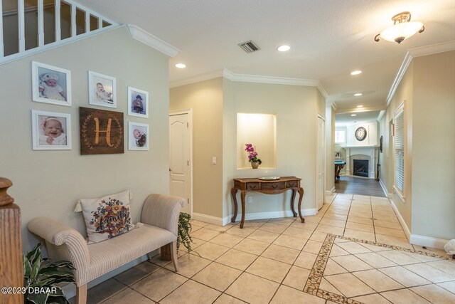 10 Foxhunter Flt, Ormond Beach, FL 32174 - corridor with ornamental molding, recessed lighting, light tile patterned floors, and visible vents