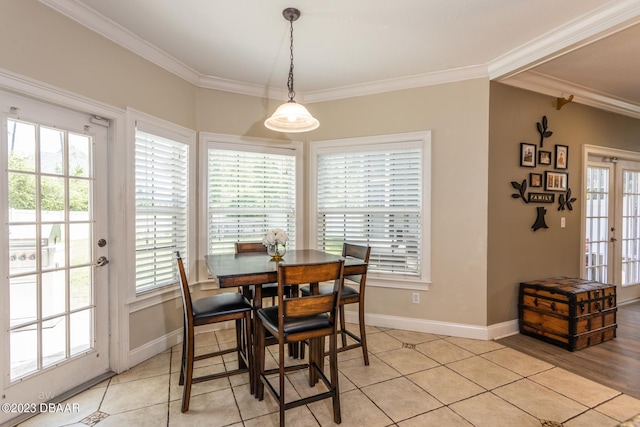 10 Foxhunter Flt, Ormond Beach, FL 32174 - dining room with baseboards, ornamental molding, and a healthy amount of sunlight