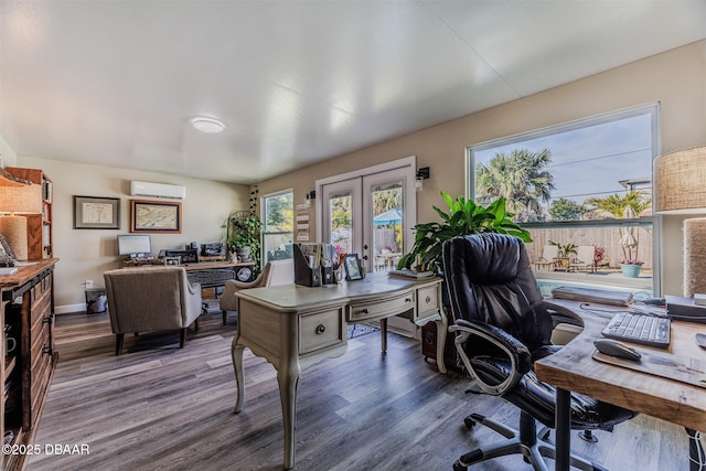 office with an AC wall unit, dark wood-type flooring, and french doors