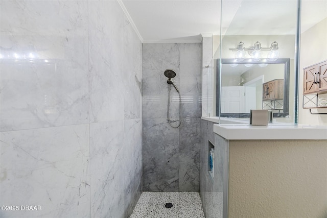 bathroom with ornamental molding and a tile shower