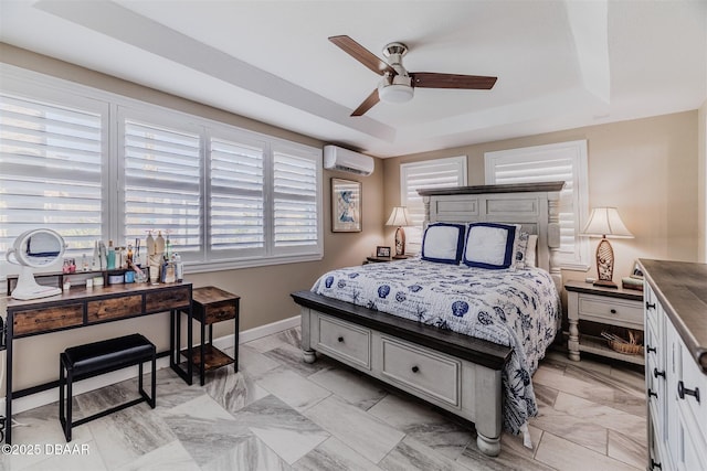 bedroom featuring ceiling fan, a wall mounted air conditioner, and a tray ceiling