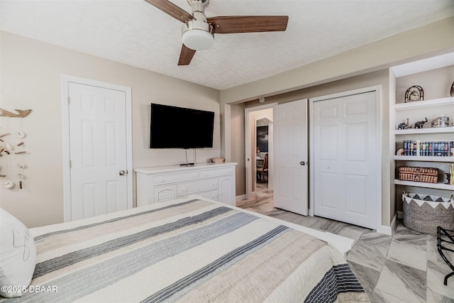 bedroom with ceiling fan and a closet