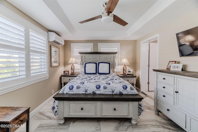 bedroom featuring ceiling fan, a tray ceiling, and a wall mounted AC