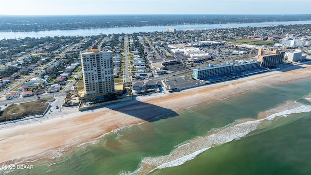 aerial view with a water view and a view of the beach