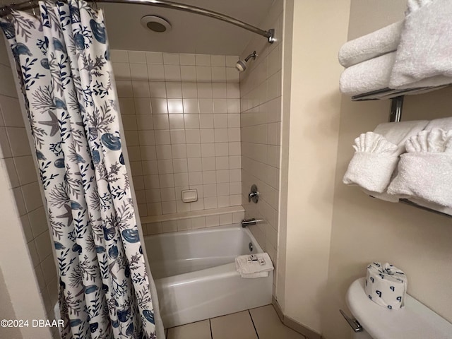 bathroom featuring tile patterned floors and shower / bath combo with shower curtain