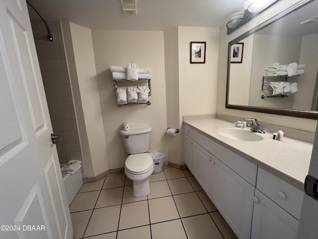 full bathroom with vanity, tile patterned flooring, radiator heating unit, toilet, and tiled shower / bath