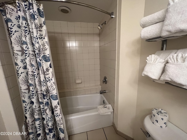 bathroom featuring tile patterned flooring and shower / bath combo