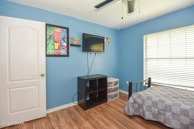 bedroom featuring hardwood / wood-style flooring and ceiling fan