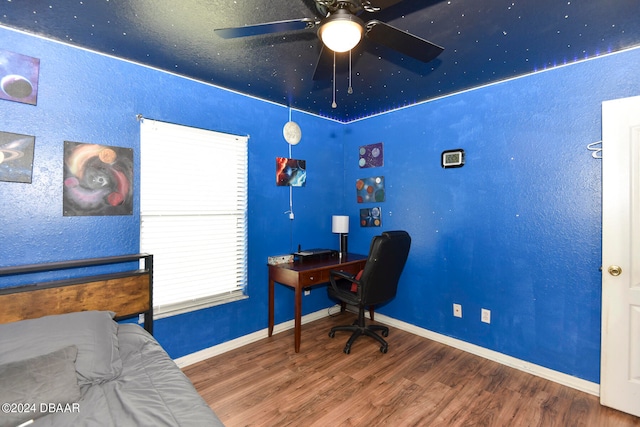 bedroom with hardwood / wood-style flooring and ceiling fan