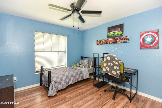 bedroom with hardwood / wood-style floors and ceiling fan