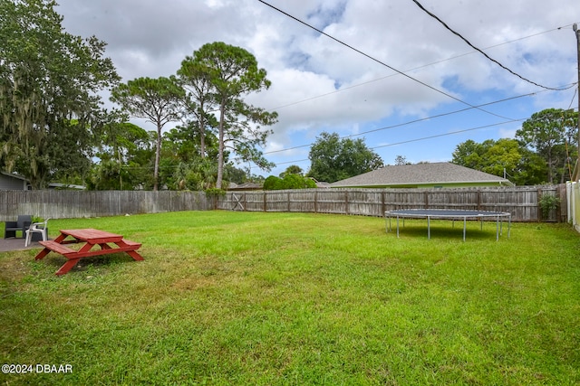 view of yard featuring a trampoline