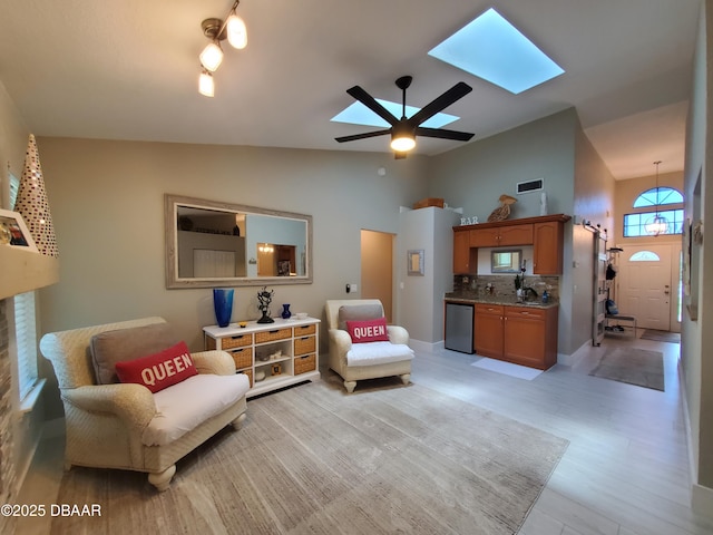 1941 Spruce Creek Lndg, Port Orange, FL 32128 - living area featuring vaulted ceiling, a skylight, and a ceiling fan