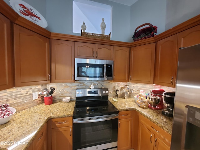 1941 Spruce Creek Lndg, Port Orange, FL 32128 - kitchen with appliances with stainless steel finishes, backsplash, and light stone countertops
