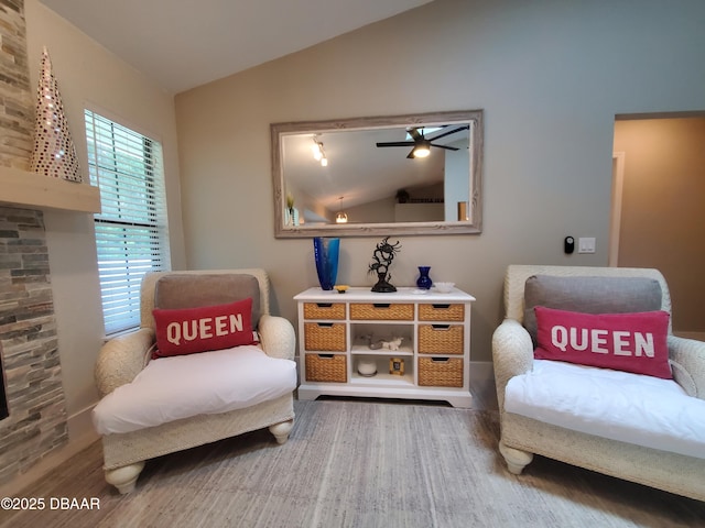 1941 Spruce Creek Lndg, Port Orange, FL 32128 - living area featuring lofted ceiling, wood finished floors, and ceiling fan