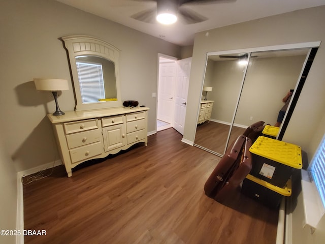 1941 Spruce Creek Lndg, Port Orange, FL 32128 - bedroom with dark wood-style floors, a closet, and a ceiling fan