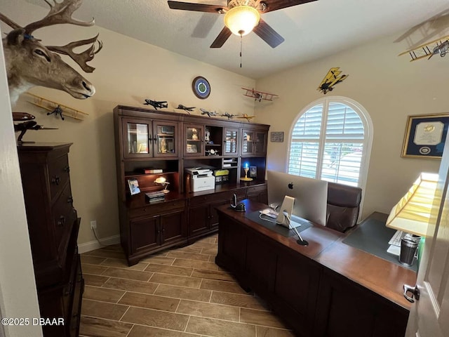 office with ceiling fan and hardwood / wood-style flooring