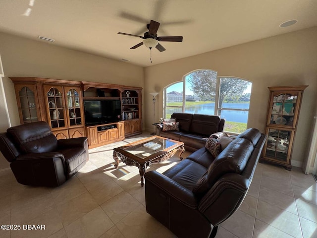 tiled living room with ceiling fan