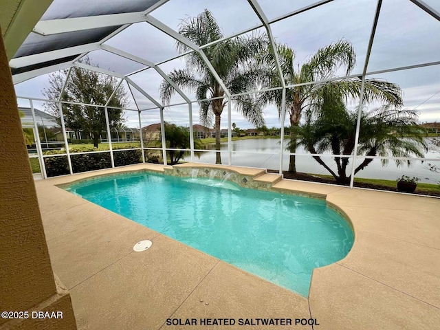 view of pool featuring a patio area, pool water feature, a lanai, and a water view