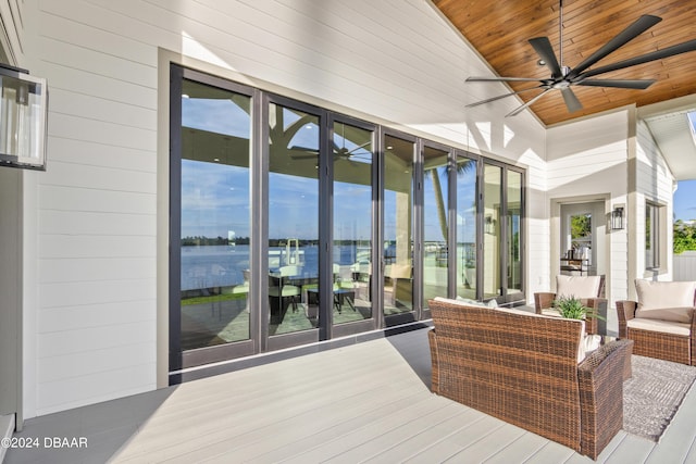 interior space featuring a water view and ceiling fan