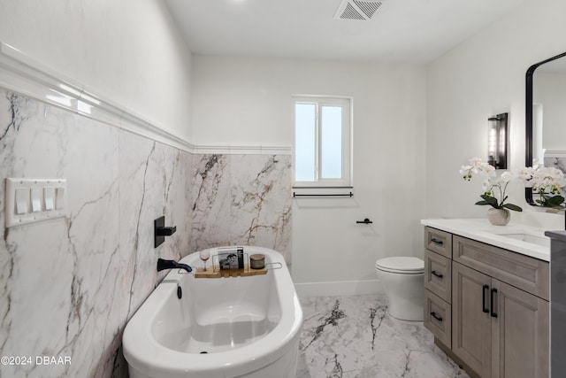 bathroom featuring a washtub, toilet, tile walls, and vanity