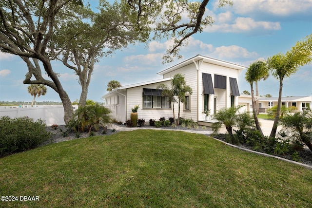 view of front of home with a front yard