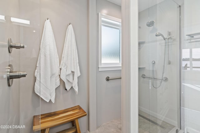 bathroom featuring a shower with shower door