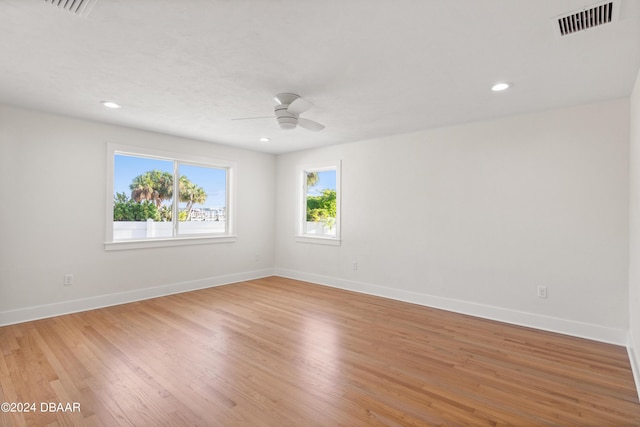 empty room with wood-type flooring and ceiling fan