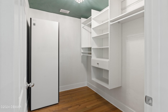 walk in closet featuring hardwood / wood-style floors