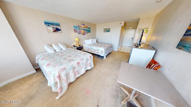 bedroom featuring carpet flooring, a textured ceiling, and baseboards