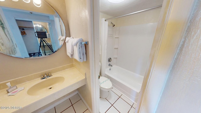 full bathroom with tile patterned floors, toilet, vanity, and shower / tub combination