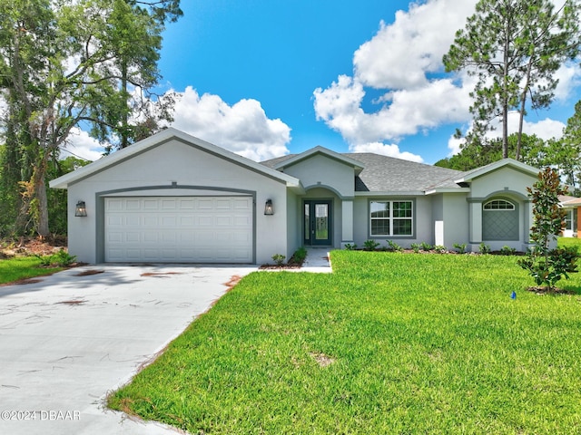 ranch-style home featuring a garage and a front lawn