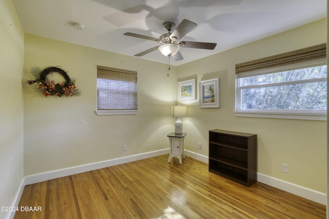 empty room featuring ceiling fan and light hardwood / wood-style floors