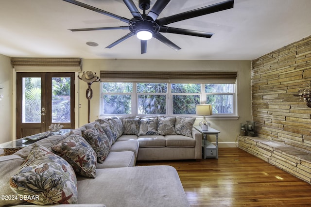 living room with hardwood / wood-style flooring, ceiling fan, and french doors