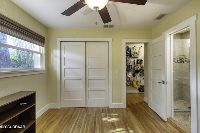 bedroom with light wood-type flooring and ceiling fan