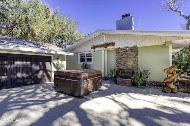 back of house with a garage