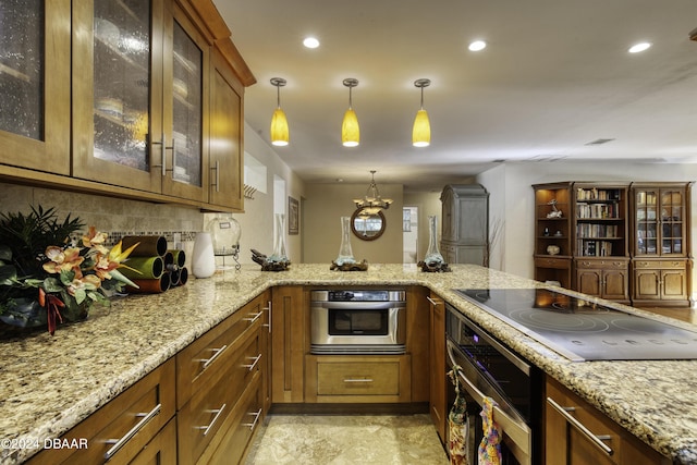 kitchen with stainless steel oven, light stone counters, decorative light fixtures, black electric cooktop, and decorative backsplash