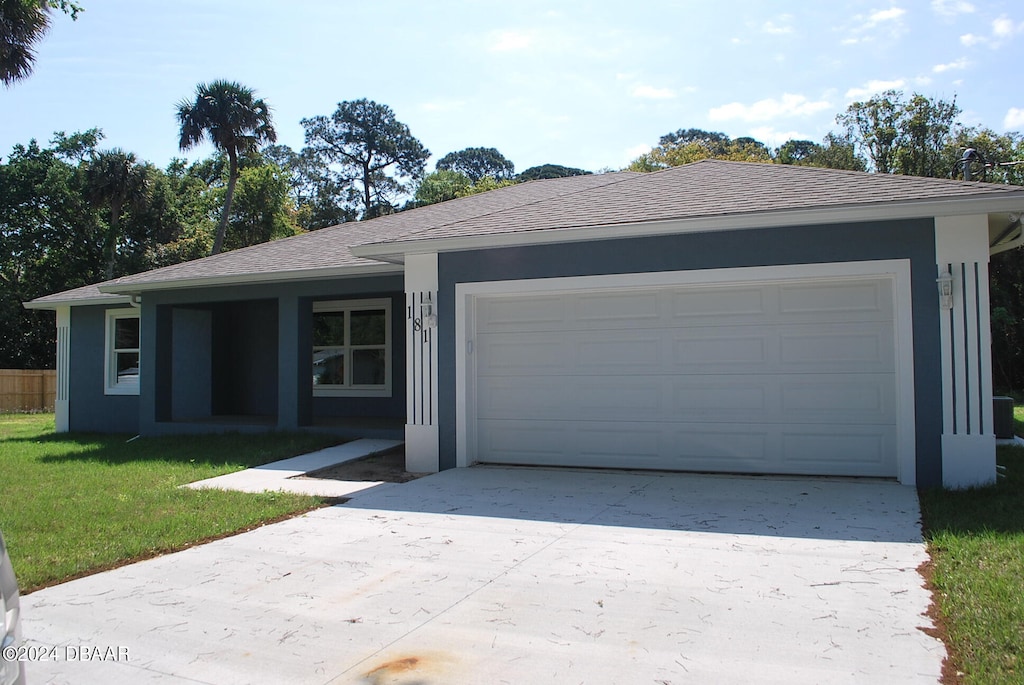 ranch-style house with a front lawn and a garage