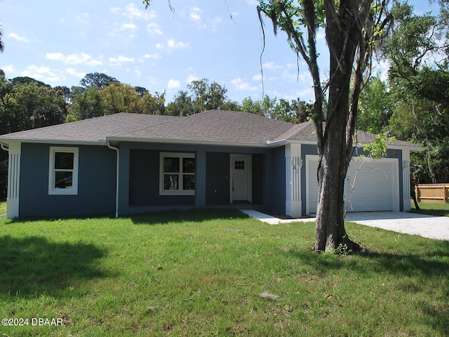 ranch-style house featuring a front lawn and a garage