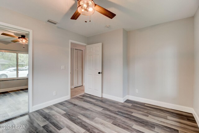 unfurnished bedroom with hardwood / wood-style flooring and ceiling fan