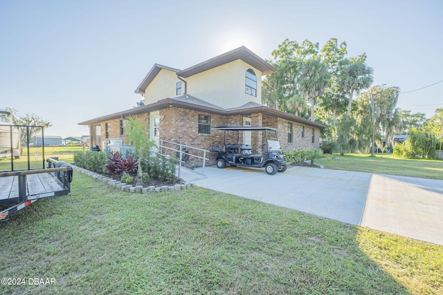 view of property exterior with a yard