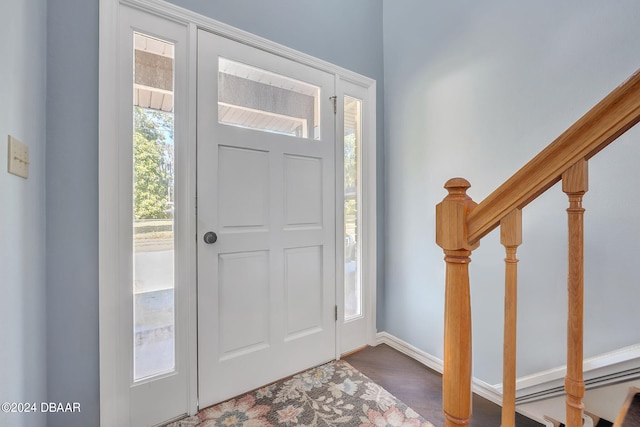 foyer entrance featuring dark hardwood / wood-style flooring