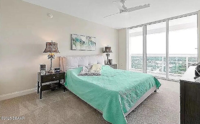 bedroom featuring baseboards, carpet floors, ceiling fan, floor to ceiling windows, and access to outside