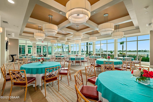 dining area featuring wood finished floors, visible vents, and coffered ceiling