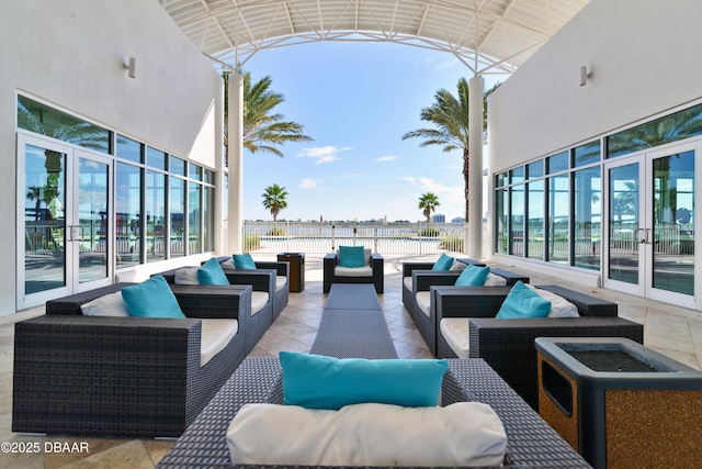 view of patio with an outdoor living space and french doors