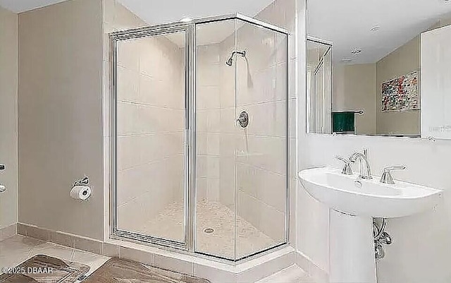 bathroom featuring a shower stall