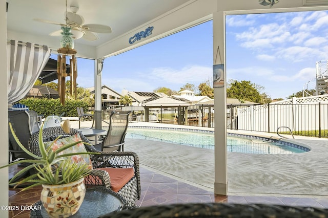 view of pool featuring a patio area and ceiling fan