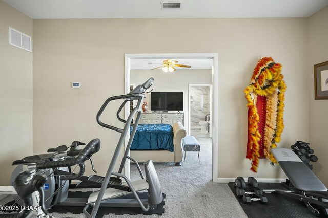 workout room featuring carpet and ceiling fan